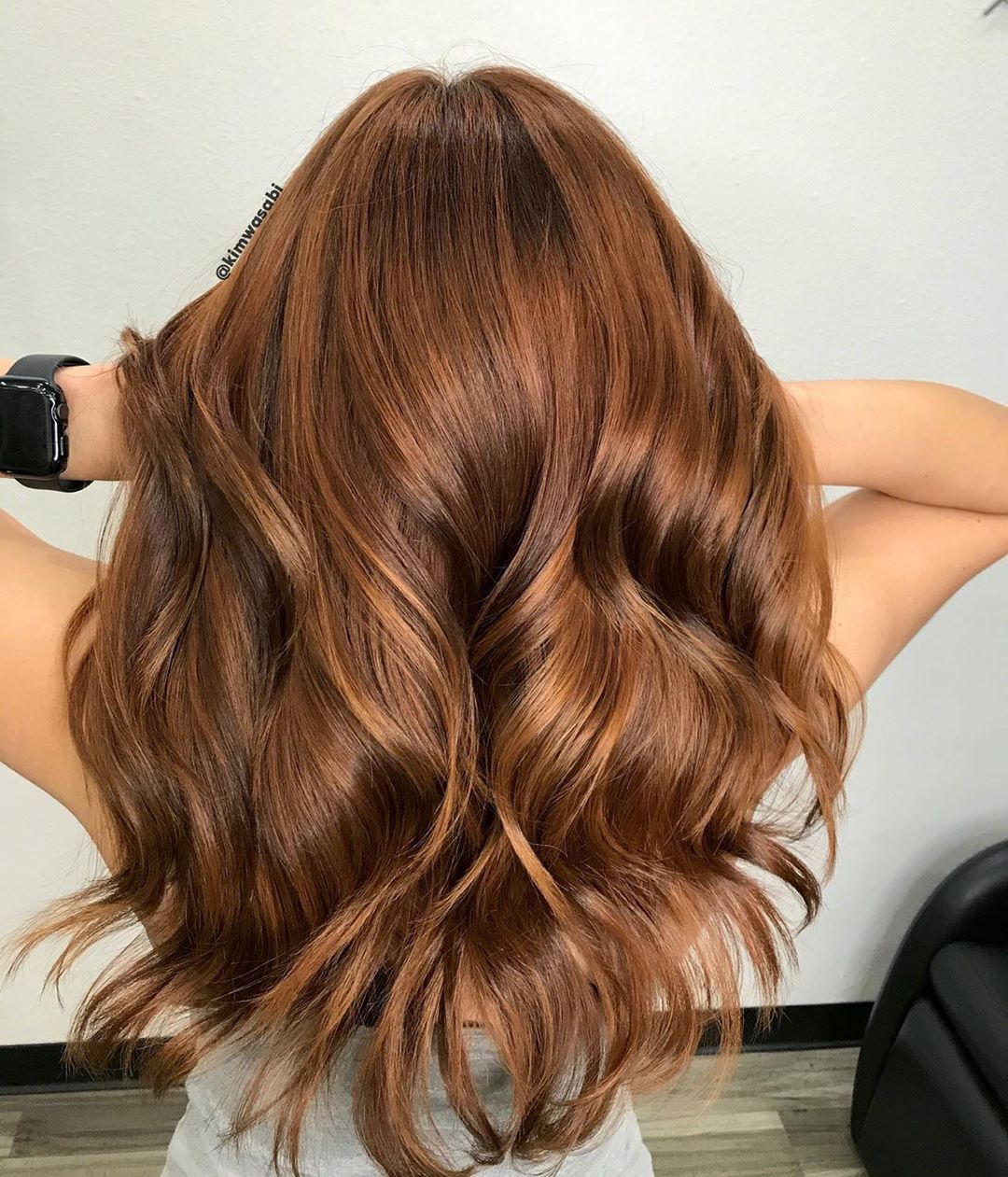 bright brown with red hues hair 