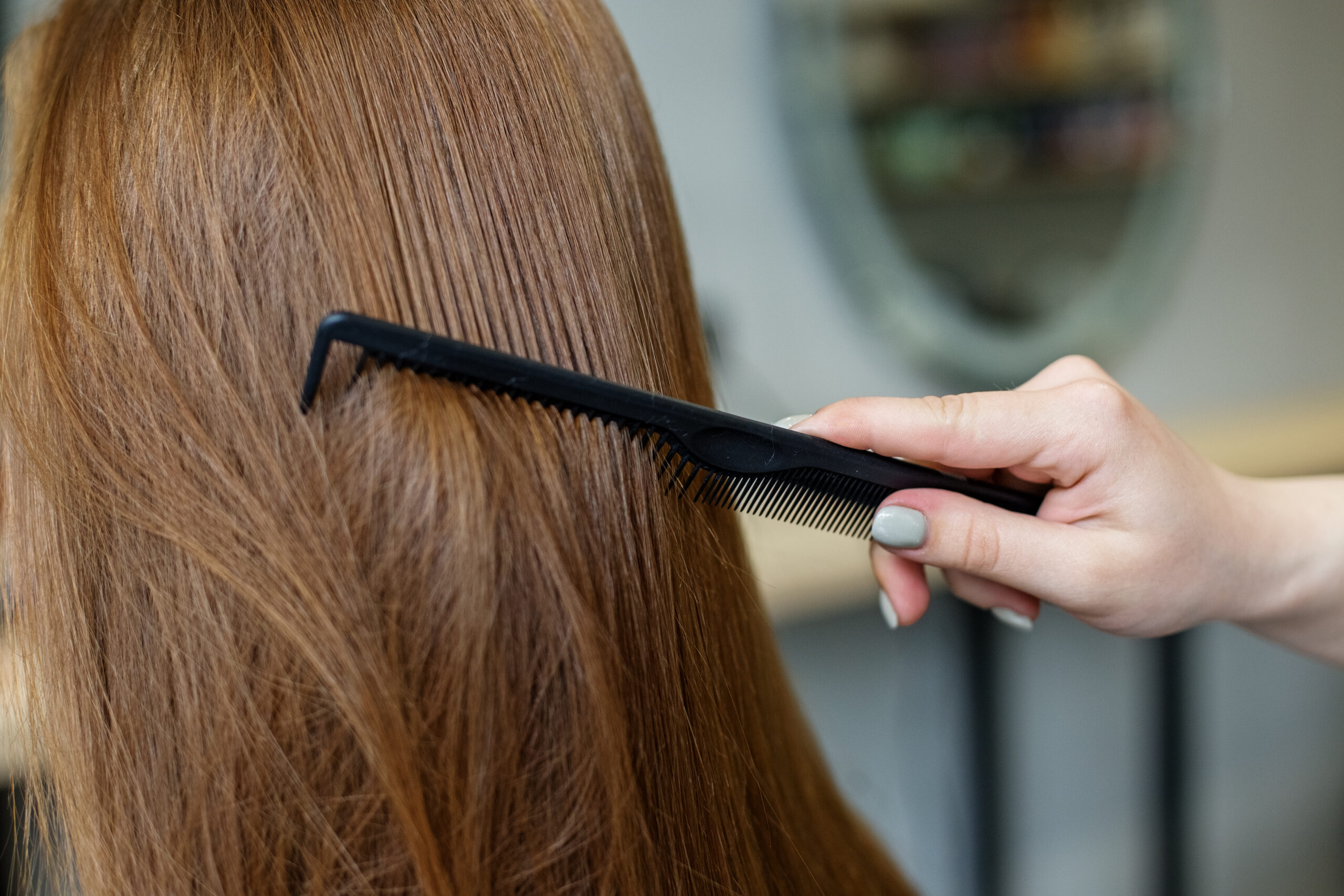 combing woman's hair